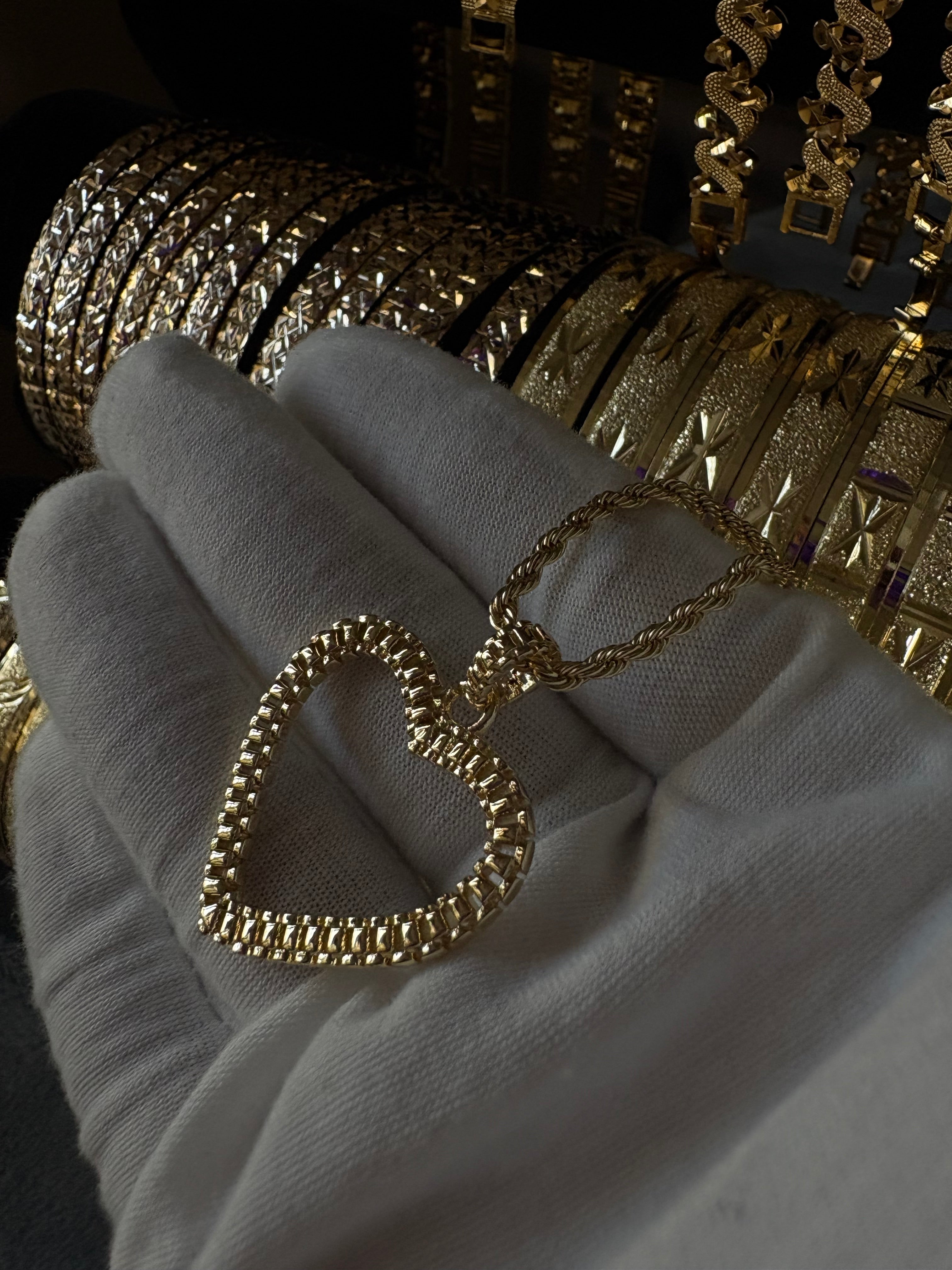 Rolex heart pendant